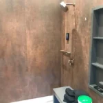 Bronze and copper toned shower tile design