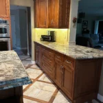 Wood cabinetry kitchen with granite countertops