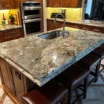 Wood cabinetry kitchen with granite island and pendant lighting