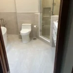 Bathroom with two tone tile walls