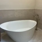 Oval freestanding white soaking tub