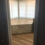 Corner soaking tub in bathroom