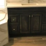 Dark vanity with marble countertop detail