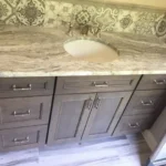 Ornate marble vanity countertop with vessel sink