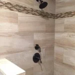 Tile shower wall with fixtures