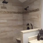 Tile shower with corner shelf and fixtures