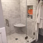 Glass shower with tiled niche and towel bar