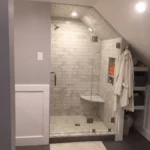 Glass enclosed shower with tile surround