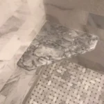 Marble tile detail with mosaic accent