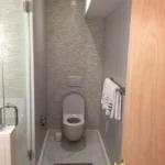 Bathroom with toilet and tile flooring