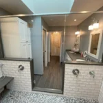 Bathroom suite with double vanity and glass shower