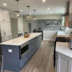 Kitchen with two-tone gray and white cabinets and large island