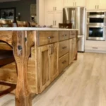 Kitchen with live-edge wood island and built-in wall ovens