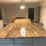 Close-up of veined marble countertop during installation