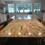 Close-up of veined marble countertop with under-cabinet lighting