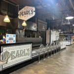 Pearl's Oyster Bar commercial counter with hanging signage